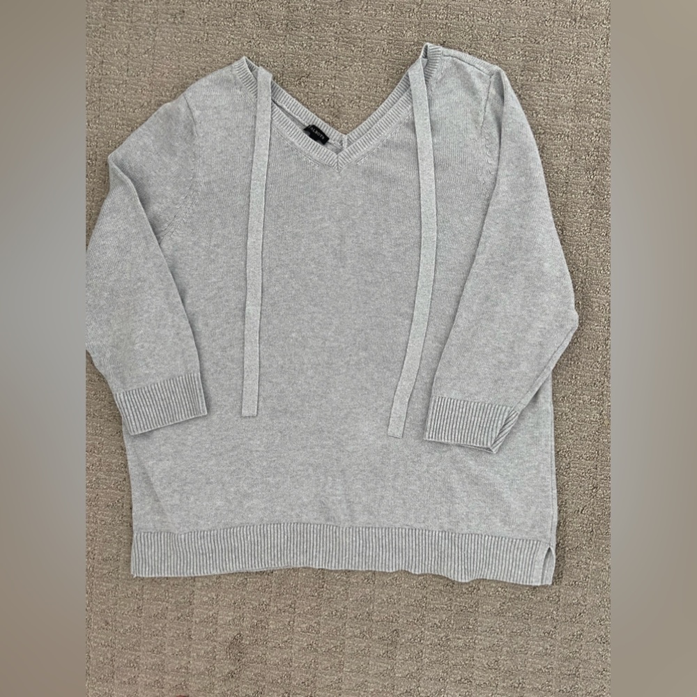 Knit grey top with silver lurex throughout.